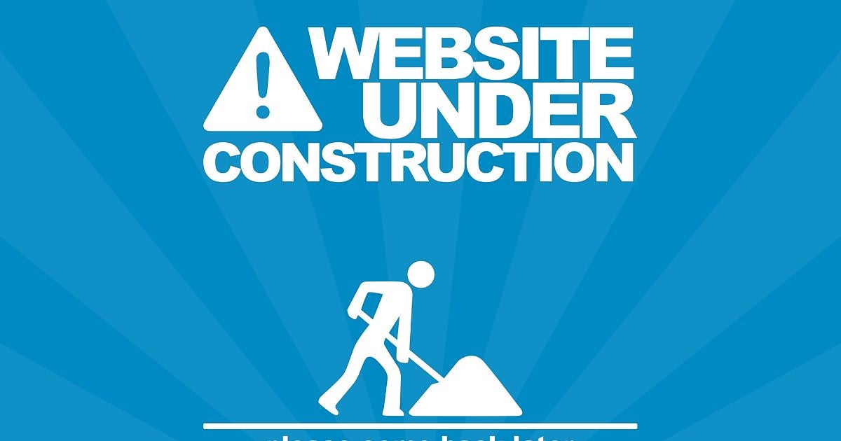 A white stick figure with a shovel and a title that reads "website under construction"